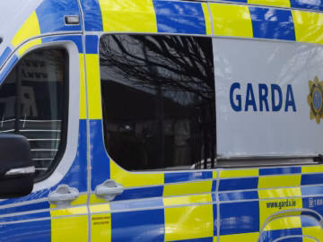 Serving garda arrested after €100,000 of seized drugs Garda police van